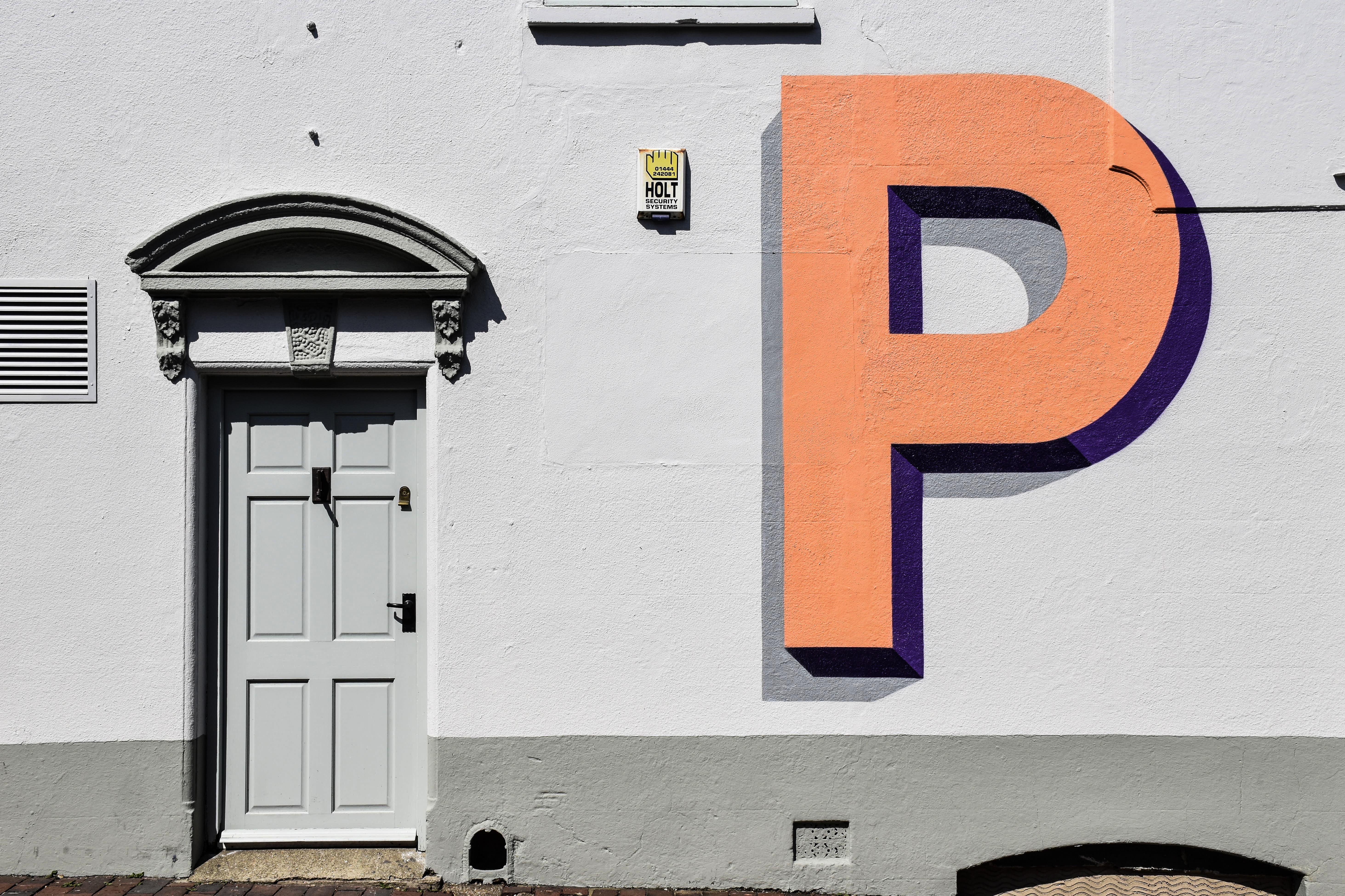 Letter P on a wall next to a door